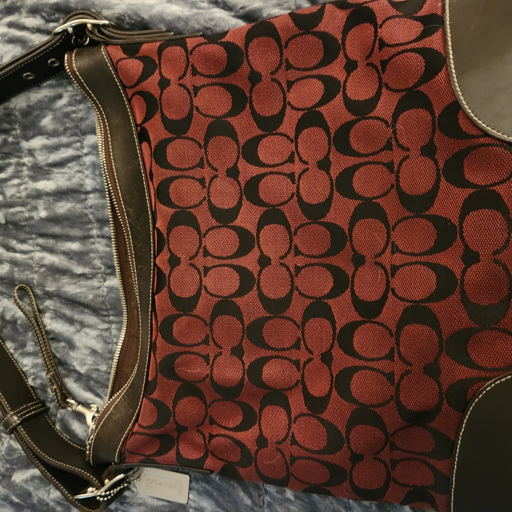 Coach Burgandy and Black Shoulder Bag with Signature Monogram.